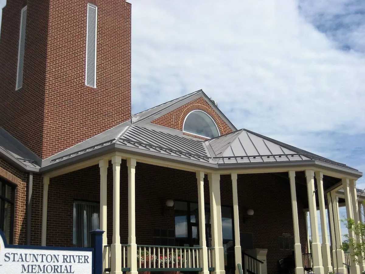 Skilled roofing craftsmen working on a residential roof in Conway
